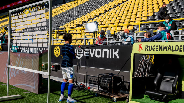 Weston McKennie performs a socially distant TV interview
